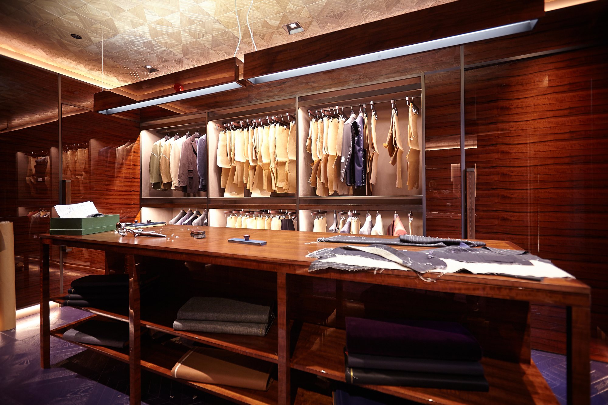 A man in a precisely tailored bespoke suit — the discipline of executive presence